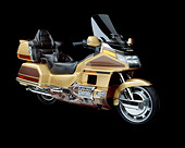 MOT 03 RK0002 04
1991 Honda GoldWing Anniversary Ed. Gold 3/4 front in studio on black