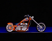 MOT 04 RK0020 04
2003 Riff Raff Custom Chopper Orange Blue Flames Profile View Studio
