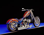 MOT 04 RK0129 06
2005 Fine Line, Chopper, Blue With Flames 3/4 Rear View On Purple Floor Studio