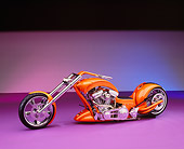 MOT 04 RK0147 04
2006 Brouhard Custom Softail Pearl Orange 3/4 Side View On Purple Floor Studio