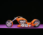 MOT 04 RK0149 06
2006 Brouhard Custom Softail Pearl Orange Profile View On Purple Floor Studio