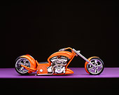 MOT 04 RK0150 12
2006 Brouhard Custom Softail Pearl Orange Profile View On Purple Floor Studio
