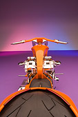 MOT 04 RK0180 01
2006 Brouhard Custom Softail Pearl Orange Overhead Rear View On Purple Floor