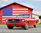 MST 01 BK0009 01
1965 Ford Mustang Convertible Red 3/4 Front View On Gravel By Barn With American Flag