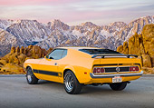 MST 01 BK0017 01
1973 Ford Mustang Mach 1 Grabber Yellow 3/4 Rear View On Pavement By Snowy Mountain Peaks