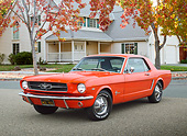 MST 01 BK0061 01
1965 Ford Mustang Poppy Red 3/4 Front View On Pavement By House And Autumn Trees