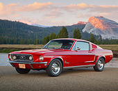 MST 01 BK0081 01
1968 Ford Mustang Fastback Red 3/4 Front View On Pavement By Water And Mountains At Dusk
