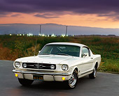 MST 01 RK0120 01
1965 Ford GT Mustang Fastback White 3/4 Front On Pavement Parking Lights On Gray Cloudy Skies