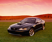 MST 01 RK0547 02
2001 Ford Mustang Bullet Green 3/4 Front View On Grass Hills Red Sky