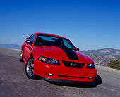 MST 01 RK0663 02
2004 Ford Mustang Mach 1 40th Anniversary Orange And Black 3/4 Front View On Pavement Hill Blue Sky