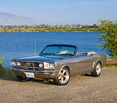 MST 01 RK1135 01
1964 1/2 Ford Mustang Convertible Pewter 3/4 Front View On Gravel By Lake