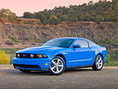 MST 01 RK1179 01
2010 Ford Mustang GT Premium Coupe Blue 3/4 Front View On Pavement By Lake