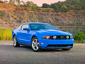 MST 01 RK1181 01
2010 Ford Mustang GT Premium Coupe Blue 3/4 Front View On Pavement By Lake