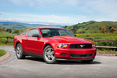 MST 01 RK1250 01
2011 Ford Mustang V6 Coupe Red 3/4 Front View On Pavement By Grassy Field