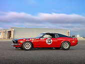 MST 01 RK1327 01
1969 Ford Mustange Boss 302 Trans Am Race Car Red, White And Black Profile View On Pavement By Hangars At Dusk