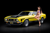 MST 01 RK1468 01
1971 Ford Mustang Boss 351 Yellow 3/4 Front View On Pavement With Swimsuit Model
