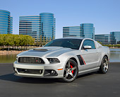 MST 01 RK1492 01
2013 Ford Roush Stage 3 Mustang Silver 3/4 Front View On Pavement By Glass Buildings