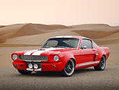 MST 01 RK1543 01
1965 Ford Mustang Fastback Hot Rod Red With White Stripes 3/4 Front View On Pavement By Sand Dunes