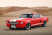 MST 01 RK1544 01
1965 Ford Mustang Fastback Hot Rod Red With White Stripes 3/4 Front View On Pavement By Sand Dunes