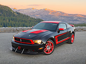 MST 01 RK1639 01
2012 Ford Mustang Boss 302 Laguna Seca Edition Black And Red 3/4 Front View On Pavement In Mountains At Dusk