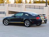 MST 01 CW0020 01
2006 Ford Shelby GT-H Black And Gold 3/4 Rear View On Pavement