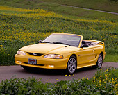 MST 01 RK0013 11
1994 Ford Mustang GT Convertible Yellow 3/4 Front View By Yellow Flower Field