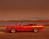 MST 01 RK0052 02
1964 1/2 Ford Red Mustang Convertible 3/4 Front View On Gravel By Water