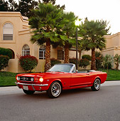 MST 01 RK0068 02
1964 1/2 Ford Mustang Convertible Red 3/4 Front View On Pavement By Building And Trees