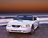 MST 01 RK0168 02
1999 Ford Mustang GT Convertible White 3/4 Front View On Sand By Ocean