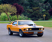 MST 01 RK0178 01
1970 Ford Mustang Mach 1 Grabber Orange 3/4 Front View On Pavement By Trees