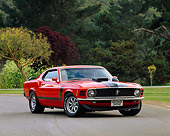 MST 01 RK0191 03
1970 Ford Mustang Boss 302 Calypso Coral 3/4 Front View On Pavement By Trees