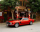 MST 01 RK0196 03
1970 Ford Mustang Boss 302 Calypso Coral 3/4 Side View On Pavement By Store