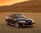 MST 01 RK0329 06
2000 Ford Mustang Roush GT Convertible Dark Blue 3/4 Front View On Pavement Hill At Dusk