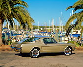 MST 01 RK0454 01
1965 Ford Mustang Fastback Honey Gold 3/4 Rear View On Pavement By Harbor