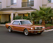 MST 01 RK0465 09
1966 Ford Mustang Convertible Emberglo White Top 3/4 Front View On Pavement By Building