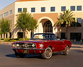 MST 01 RK0504 01
1967 Ford Mustang Convertible Burgundy 3/4 Front View On Pavement By Building And Trees