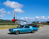 MST 01 RK0566 01
1965 Ford Mustang Fastback Aqua 3/4 Side View On Pavement By Airplane Cloudy Blue Sky
