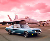 MST 01 RK0569 02
1965 Ford Mustang Fastback Aqua 3/4 Side View On Pavement By Airplane Filtered