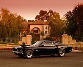 MST 01 RK0579 03
1969 Ford Mustang Boss 429 Black 3/4 Side View On Pavement By Gated House