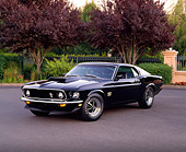 MST 01 RK0580 01
1969 Ford Mustang Boss 429 Black 3/4 Front View On Pavement By Trees
