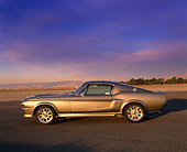 MST 01 RK0633 04
1967 Ford Mustang GT500M Fastback Silver With Black Stripes Profile View On Pavement