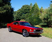 MST 01 RK0651 02
1969 Ford Mustang Mach 1 GT390 Red And Black 3/4 Front View On Pavement By Trees