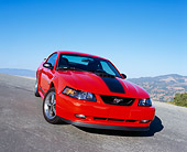 MST 01 RK0663 04
2004 Ford Mustang Mach 1 40th Anniversary Orange And Black 3/4 Front View On Pavement Hill Blue Sky