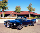 MST 01 RK0702 03
1967 Ford Mustang GTA Convertible Black 3/4 Front View On Pavement By Building