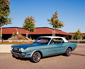 MST 01 RK0707 03
1966 Ford Mustang Turquoise White Top 3/4 Front View On Pavement By Building