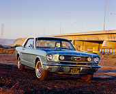 MST 01 RK0712 01
1966 Ford Mustang Turquoise White Top Low 3/4 Front View On Dirt By Bridge