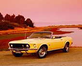 MST 01 RK0721 03
1969 Ford Mustang Convertible Yellow 3/4 Front View On Pavement By Water Filtered