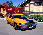 MST 01 RK0725 03
1970 Ford Mustang Boss 302 Orange Black Stripes 3/4 Front View On Pavement By Train