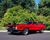 MST 01 RK0728 02
1971 Ford Mustang Boss 351 Red Black Stripes Low 3/4 Side View On Pavement By Bushes