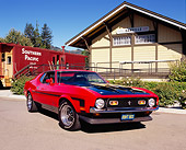 MST 01 RK0730 03
1971 Ford Mustang Boss 351 Red Black Stripes Low 3/4 Front View On Pavement By Train